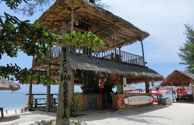 straw hut of aseania resort on pulau besar island beach