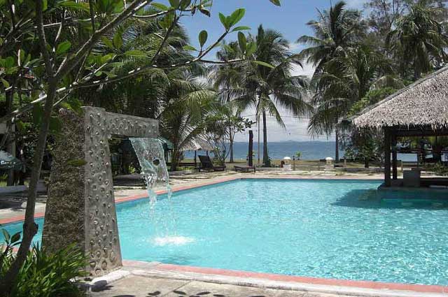 outdoor swimming pool in d coconut resort pulau besar island