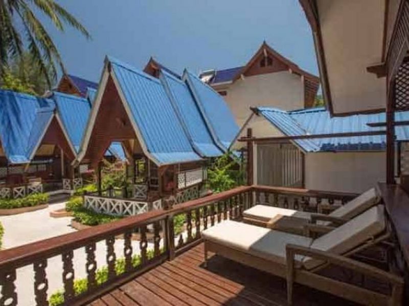 two deck chairs on room balcony in perhentian coral view resort with stunning garden view