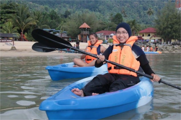 women kayaking tioman sea happy