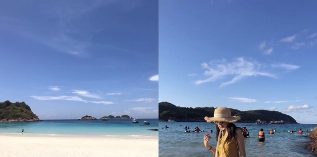 热浪岛蓝色万里无云的天空下有一位头戴草帽的女人站在海边