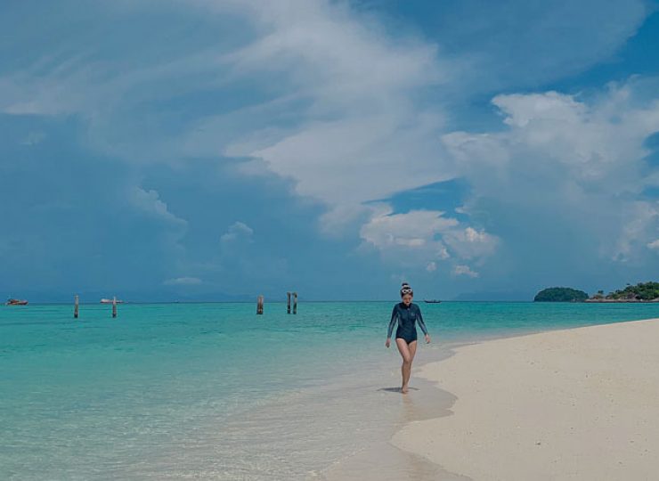 woman walking beach tinggi island malaysia