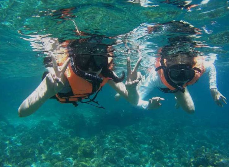 tourists snorkeling sibu island sea malaysia