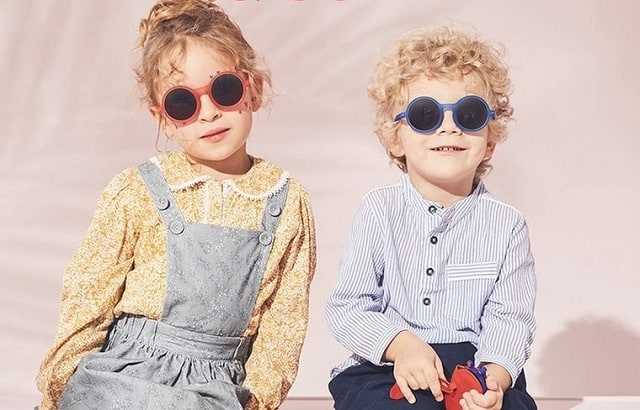 a boy and a girl wearing sunglasses