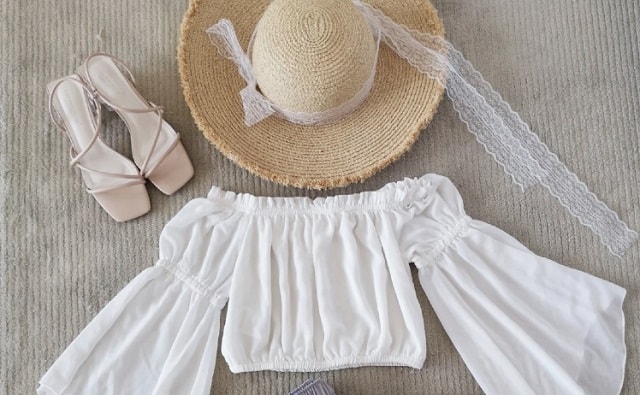 straw hat white top and nude sandal for island trip
