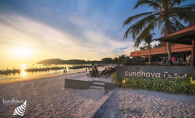 beach access to koh lipe island in front of bundhaya villas at dusk