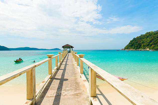 long bridge of pulau tioman pier above blue clear sea water