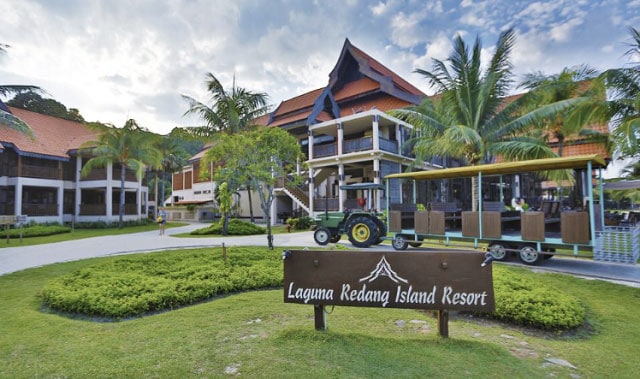 redang laguna resort front garden with resort name board on grass