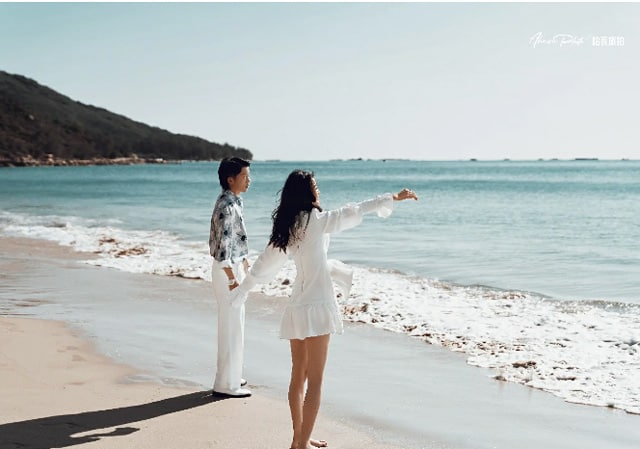 couple standing on beach of pulau besar island