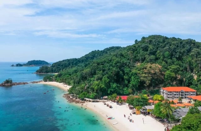aerial shoot of kapas island with jungle trees and blue clear sea water