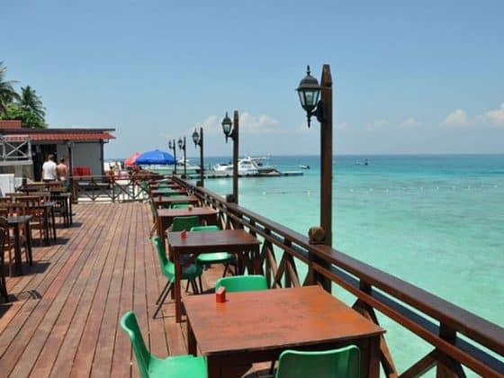 pulau perhentian besar cozy chalet resort sea view restaurant on wooden floor above clear sea