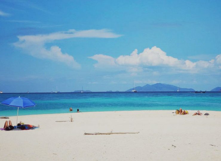 koh lipe island tourists sunbath lying