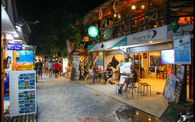 dive shop opening on walking street in koh lipe at night
