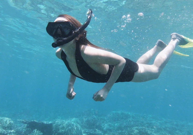 semporna timba timba island woman snorkeling