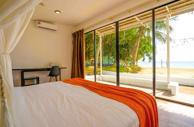 the one tenggol island resort deluxe seaview room interior with large French windows